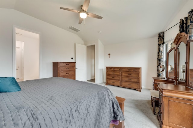 bedroom featuring lofted ceiling, light colored carpet, and ceiling fan