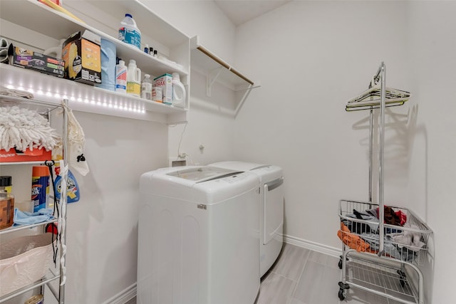 clothes washing area featuring washing machine and clothes dryer