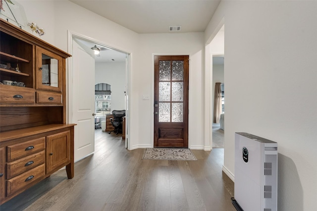 entryway featuring dark hardwood / wood-style flooring and heating unit