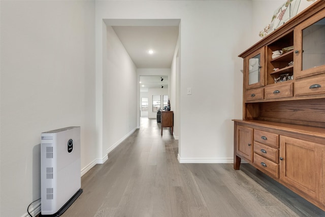 hall with light hardwood / wood-style flooring