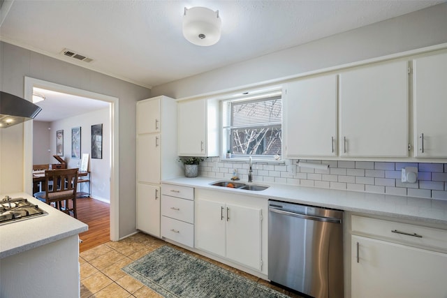 kitchen featuring white cabinetry, sink, tasteful backsplash, and appliances with stainless steel finishes