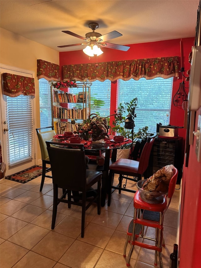 tiled dining room with ceiling fan