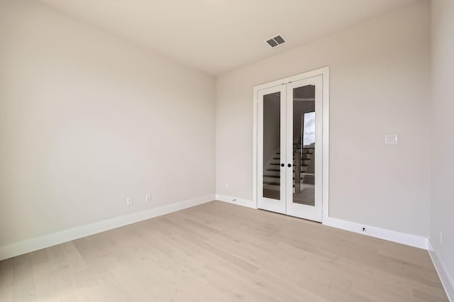 4405 Tower Bluff Rd, Midlothian, TX 76065 - empty room featuring baseboards, light wood-style flooring, and stairway