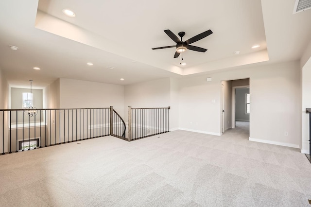 4405 Tower Bluff Rd, Midlothian, TX 76065 - spare room featuring a ceiling fan, a raised ceiling, baseboards, recessed lighting, and plenty of natural light