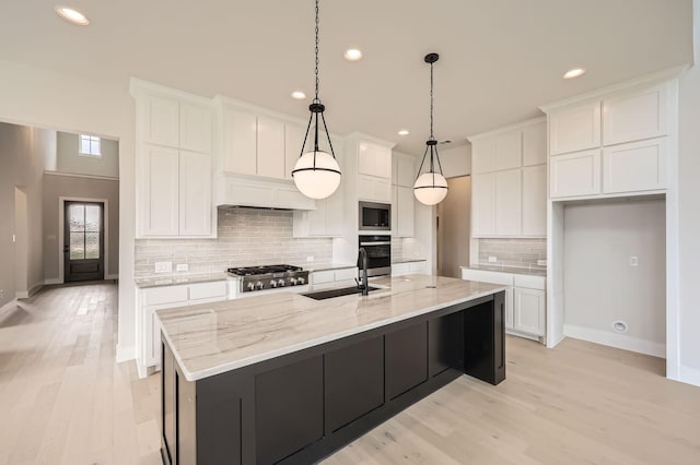 4405 Tower Bluff Rd, Midlothian, TX 76065 - kitchen featuring appliances with stainless steel finishes, a sink, white cabinetry, recessed lighting, and tasteful backsplash
