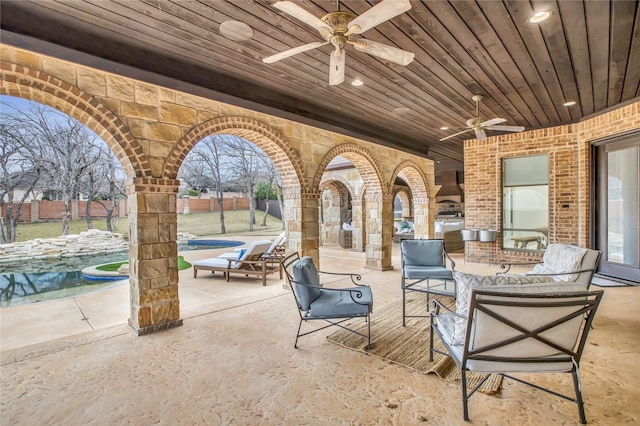 view of patio / terrace featuring ceiling fan, outdoor lounge area, and a fenced in pool