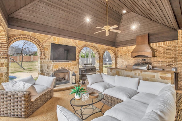 living room featuring high vaulted ceiling, wood ceiling, and an outdoor stone fireplace