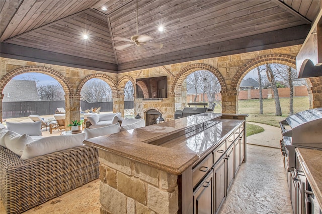 view of patio featuring outdoor lounge area and exterior kitchen