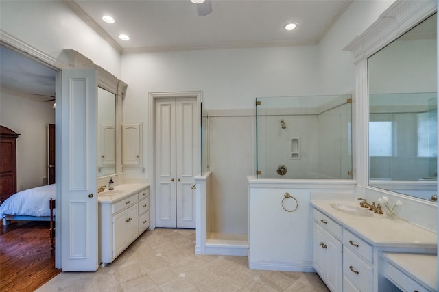 bathroom featuring vanity, crown molding, ceiling fan, and walk in shower