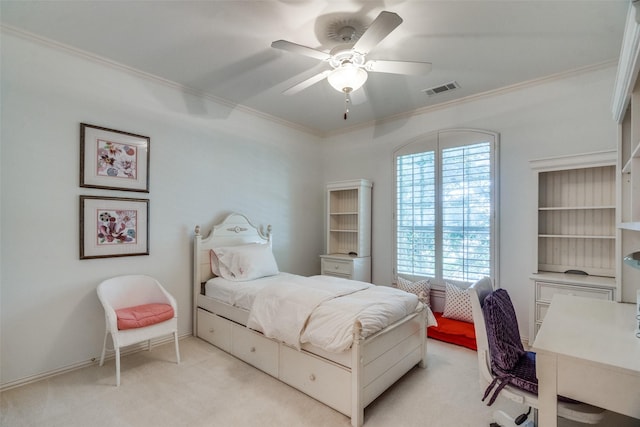 bedroom with light colored carpet, ornamental molding, and ceiling fan