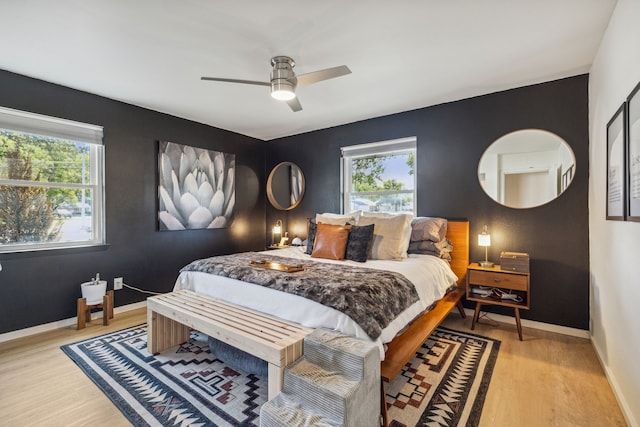 9704 Lanward Dr, Dallas, TX 75238 - bedroom with multiple windows, ceiling fan, and light hardwood / wood-style flooring