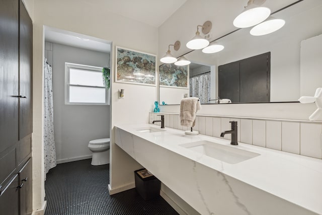 9704 Lanward Dr, Dallas, TX 75238 - bathroom with vanity and toilet