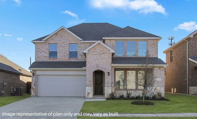 front of property featuring a garage, a front lawn, and central air condition unit