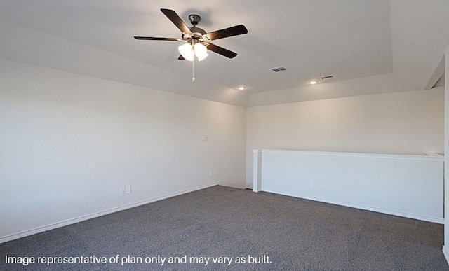 carpeted spare room with vaulted ceiling and ceiling fan