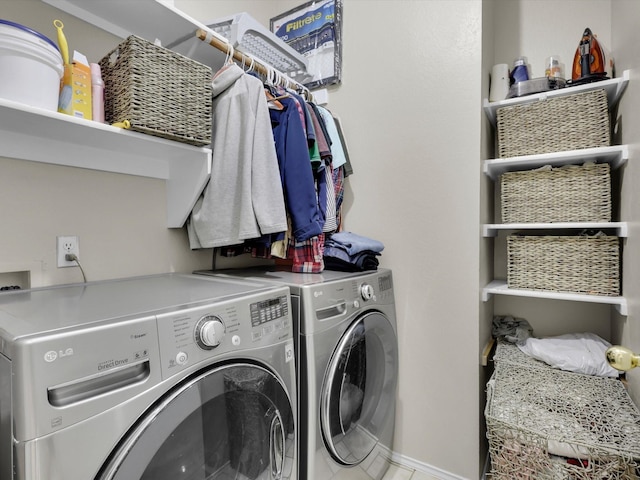 laundry room featuring laundry area, washing machine and dryer, and baseboards