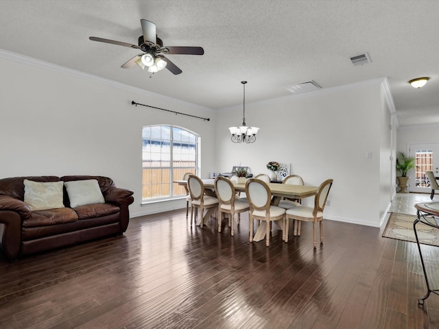 dining space featuring visible vents, wood finished floors, and ornamental molding