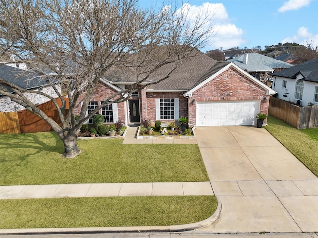 view of front of property with an attached garage, brick siding, a shingled roof, fence, and a front yard