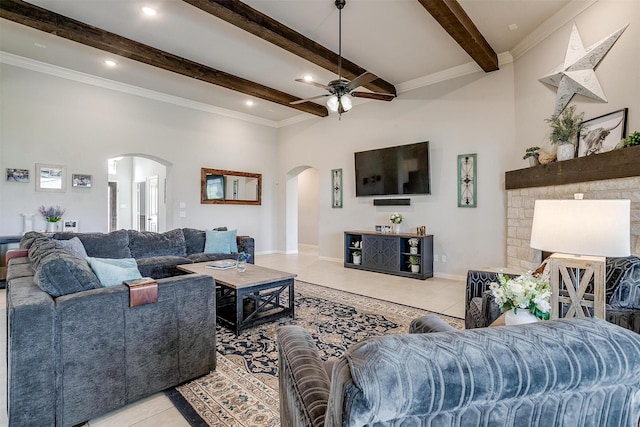 living room with light tile patterned floors, crown molding, beamed ceiling, and ceiling fan