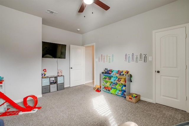 playroom featuring ceiling fan and carpet floors