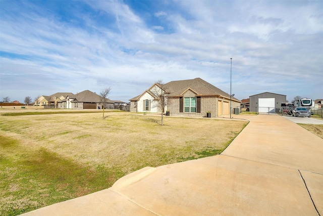 ranch-style home with a garage and a front lawn