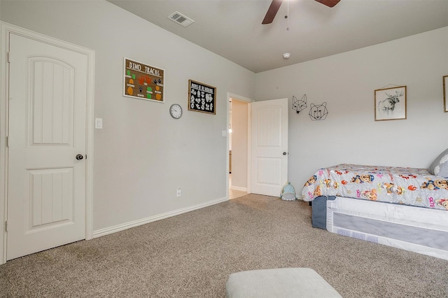 bedroom featuring ceiling fan and carpet