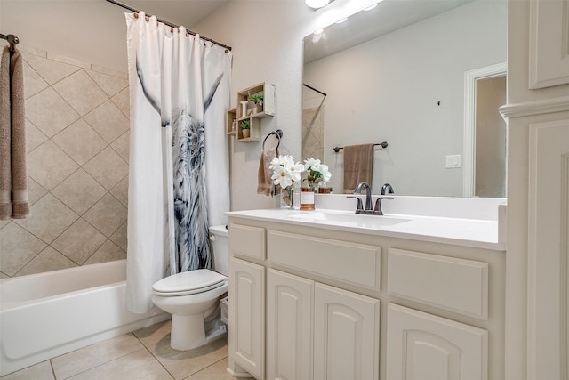 full bathroom with shower / tub combo, vanity, toilet, and tile patterned flooring