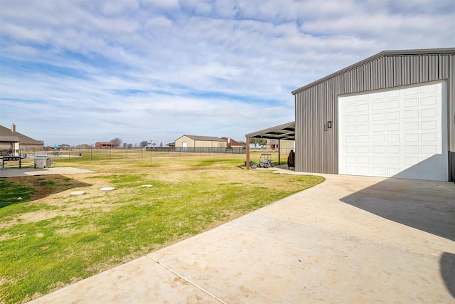 view of yard with an outbuilding and a garage