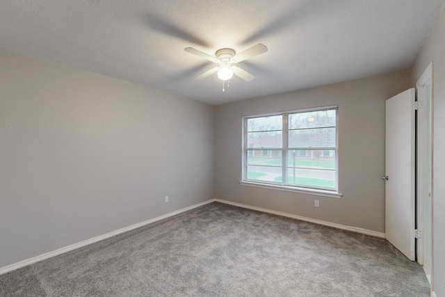 unfurnished bedroom featuring a textured ceiling, ceiling fan, and carpet