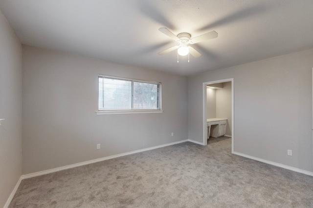 unfurnished bedroom featuring ceiling fan and light colored carpet