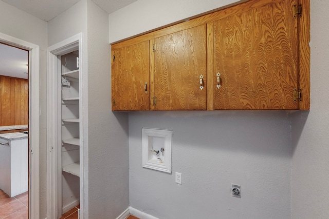 laundry room featuring cabinets, washer hookup, and hookup for an electric dryer