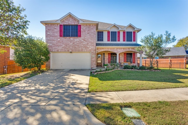 front facade featuring a front yard, a garage, and a porch