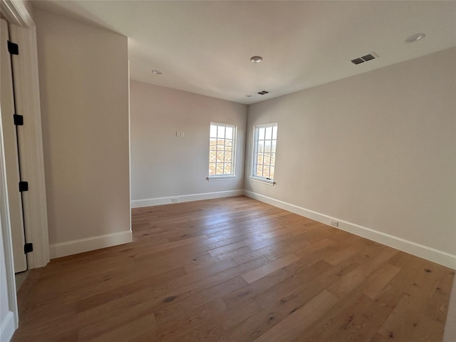 empty room featuring hardwood / wood-style floors