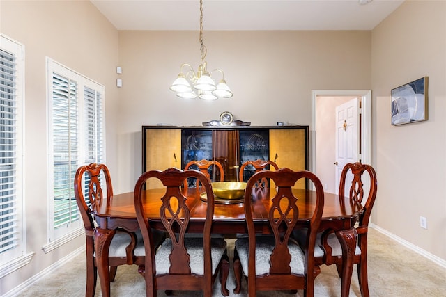 dining space featuring an inviting chandelier