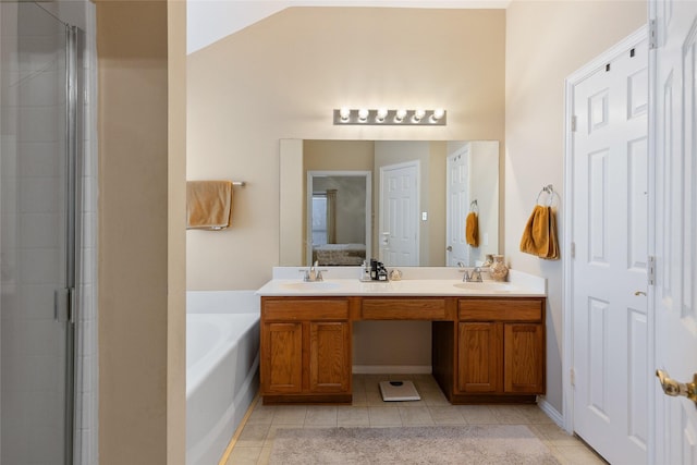 bathroom featuring vanity, lofted ceiling, tile patterned floors, and separate shower and tub