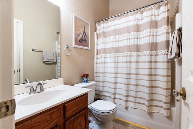 full bathroom with vanity, shower / tub combo with curtain, and toilet