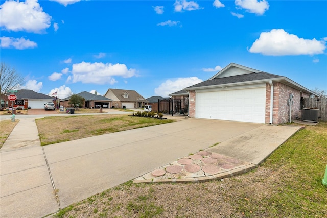 108 Red Cloud Dr, Greenville, TX 75402 - view of front of home with brick siding, concrete driveway, a garage, and a residential view