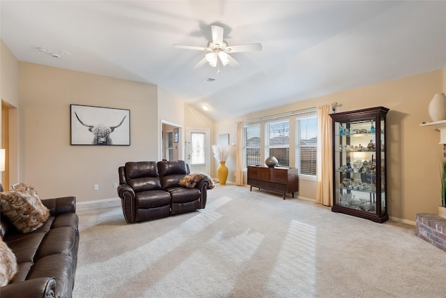 living room featuring lofted ceiling, light carpet, and ceiling fan
