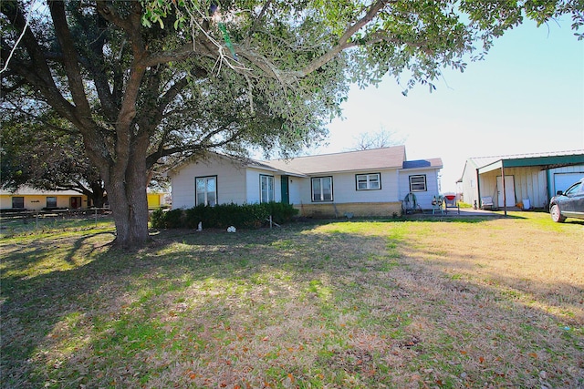 ranch-style home with fence and a front lawn