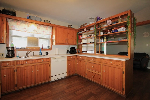 kitchen featuring brown cabinets, dark wood-style flooring, white dishwasher, light countertops, and a sink