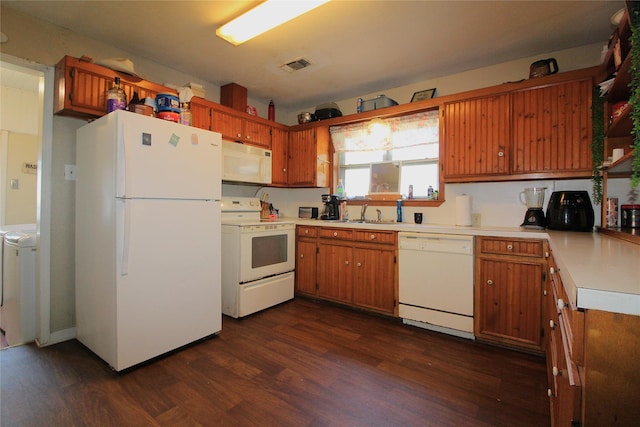 kitchen featuring dark wood-style floors, washer / clothes dryer, light countertops, visible vents, and white appliances