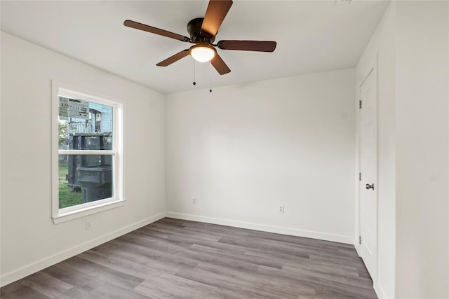 unfurnished room featuring hardwood / wood-style floors and ceiling fan