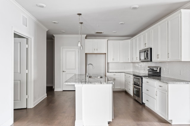 kitchen with sink, stainless steel appliances, light stone countertops, an island with sink, and white cabinets