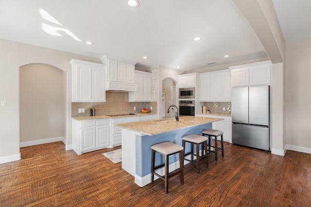 kitchen featuring white cabinets and appliances with stainless steel finishes