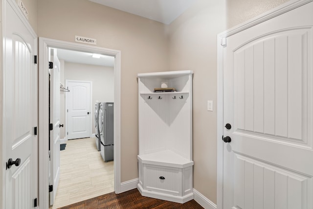 mudroom with washer and clothes dryer and hardwood / wood-style floors