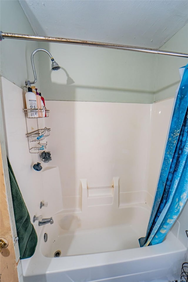 bathroom with shower / bath combination with curtain