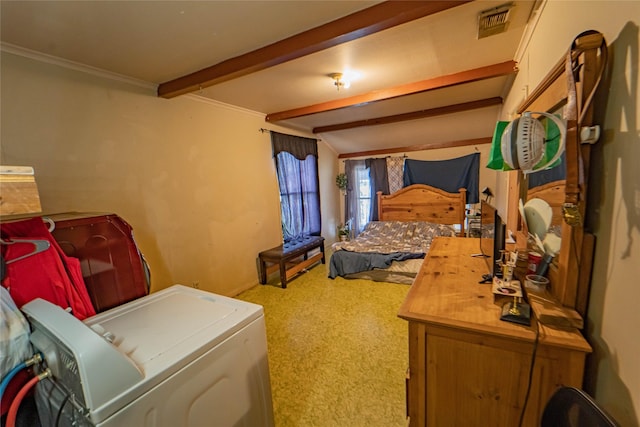 carpeted bedroom featuring beam ceiling and washer / dryer