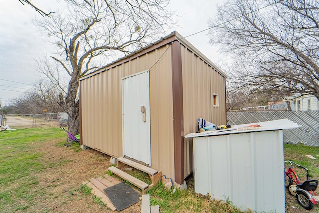 view of outdoor structure with a lawn