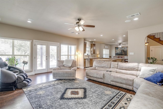 living room with visible vents, recessed lighting, french doors, and wood finished floors