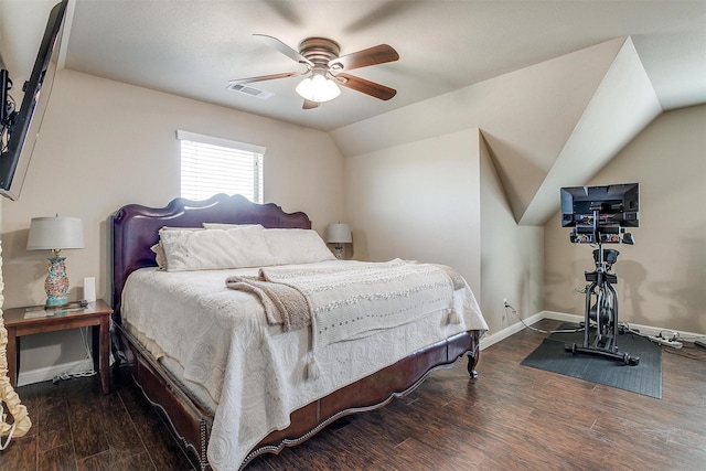 bedroom featuring wood finished floors, visible vents, baseboards, ceiling fan, and vaulted ceiling