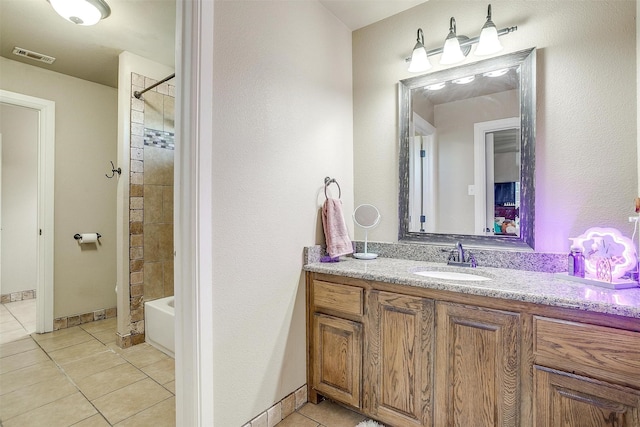 bathroom featuring vanity, tile patterned floors, visible vents, and  shower combination